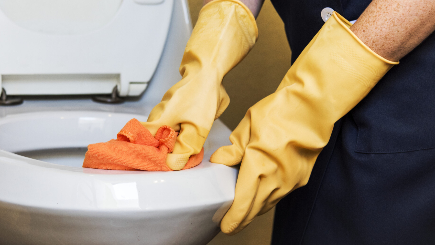 Housekeeper cleaning a hotel room