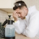 side-view-tired-man-with-disinfectant