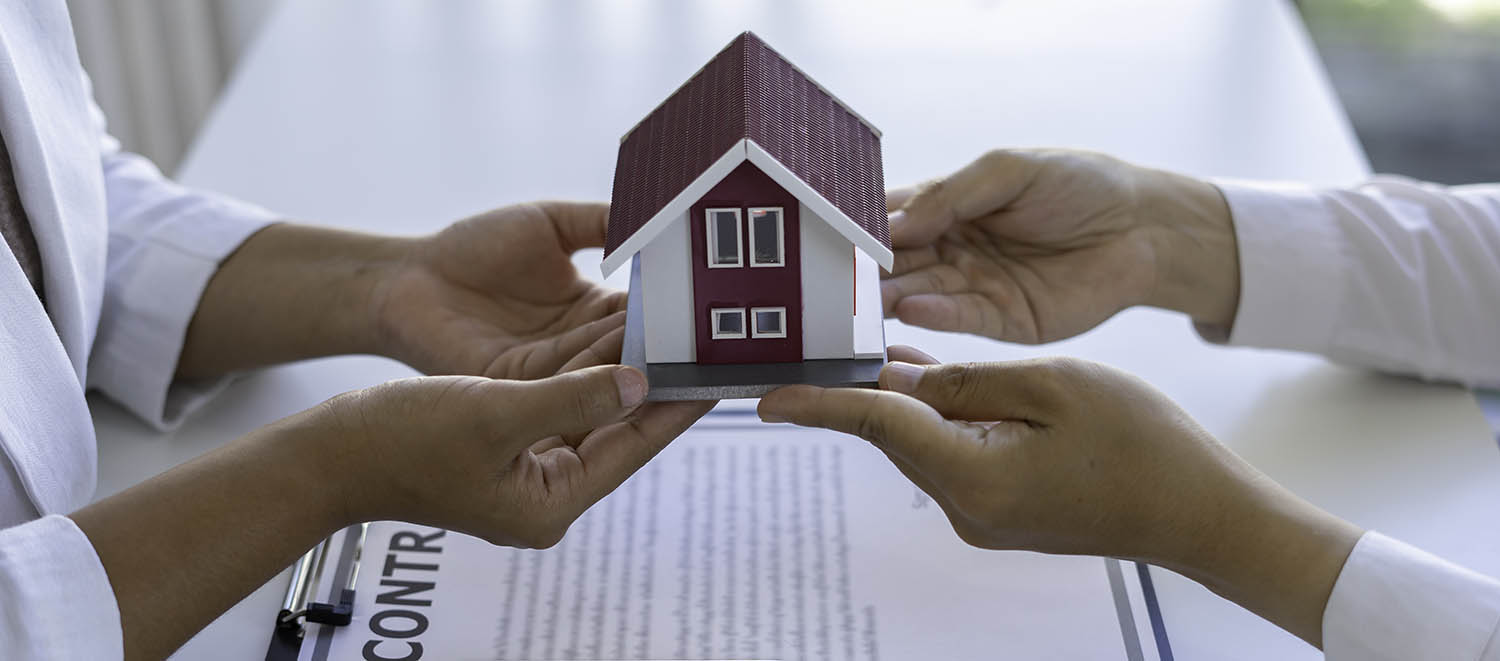 Real estate brokerage agent Deliver samples of homes offered for sale, pay deposit and sign contracts, home insurance concepts. Making lease and buying a house