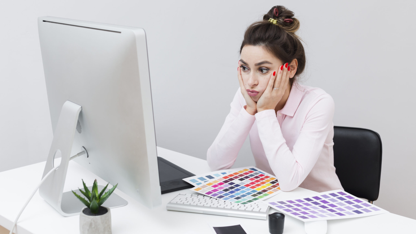 defeated-woman-sitting-desk-looking-computer