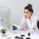 defeated-woman-sitting-desk-looking-computer