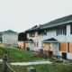 Fire-damaged apartment building with boarded windows